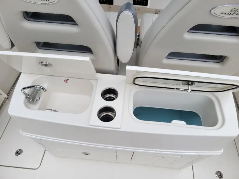 Slide: The Image of 2025 Sailfish 272 CC boat interior with sink and storage compartments. - 10