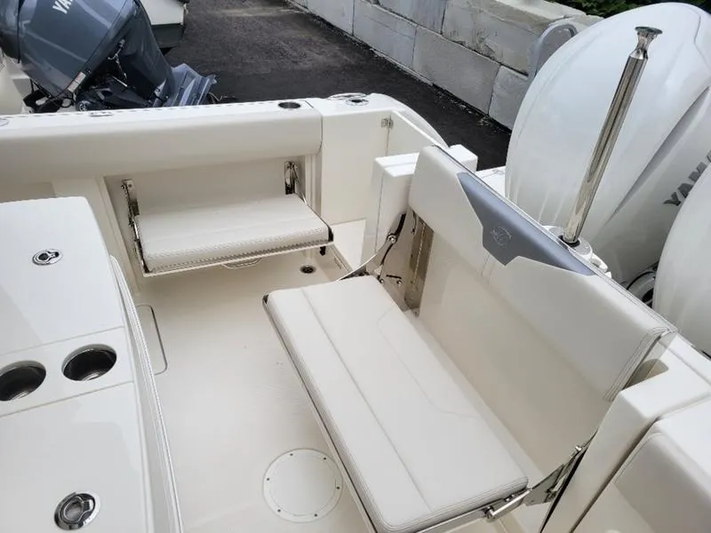 Slide: The Image of 2025 Sailfish 272 CC boat interior with foldable seating and Yamaha outboard engines. - 12