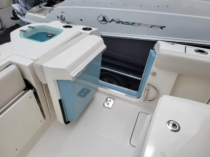 Slide: The Image of Sailfish 272 CC 2025 model boat interior with seating and storage compartments. - 14