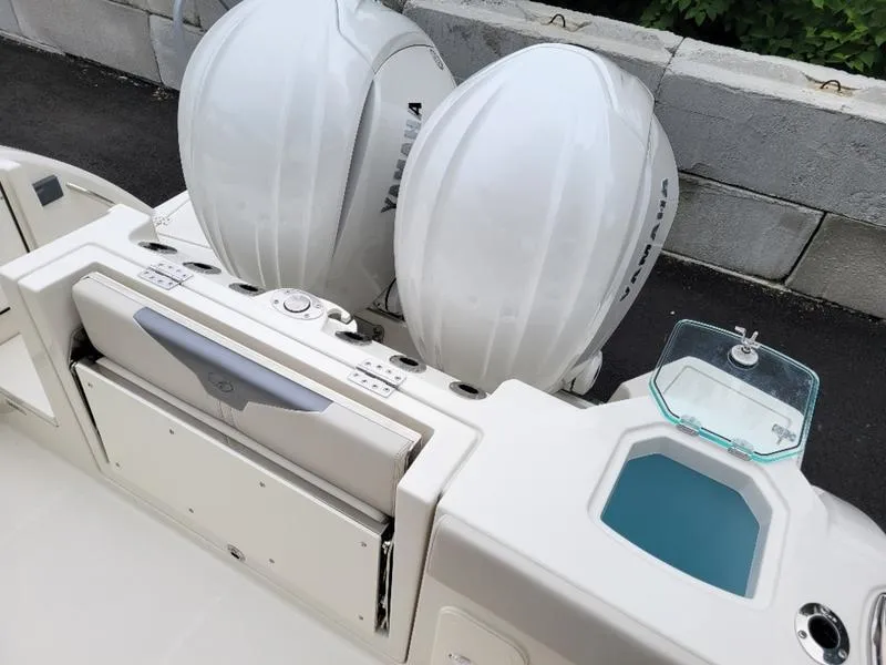 Slide: The Image of 2025 Sailfish 272 CC boat with dual Yamaha outboard engines and a livewell. - 15