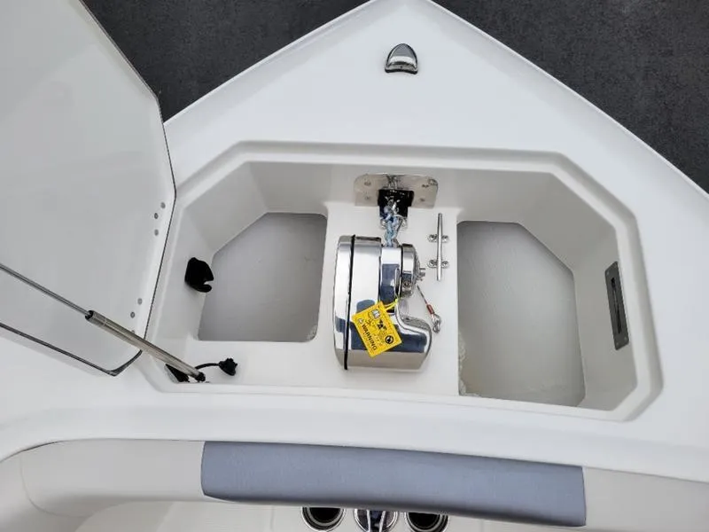 Slide: The Image of 2025 Sailfish 272 CC boat anchor compartment with stainless steel windlass. - 22
