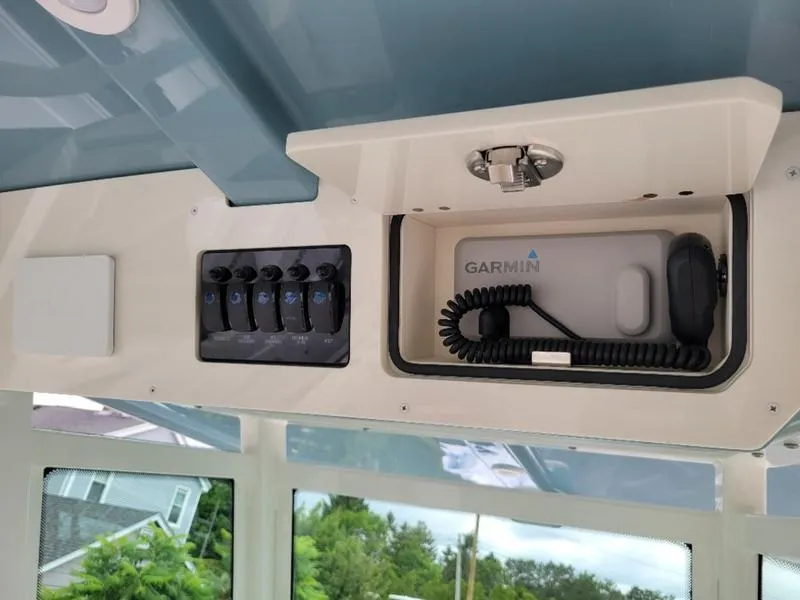 Slide: The Image of Control panel and Garmin device on 2025 Sailfish 272 CC boat. - 23