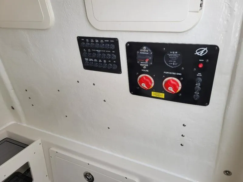 Slide: The Image of Control panel of 2025 Sailfish 272 CC boat with switches and dials. - 26