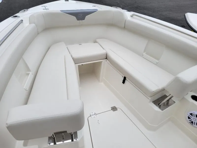Slide: The Image of 2025 Sailfish 272 CC boat interior with white cushioned seating. - 31
