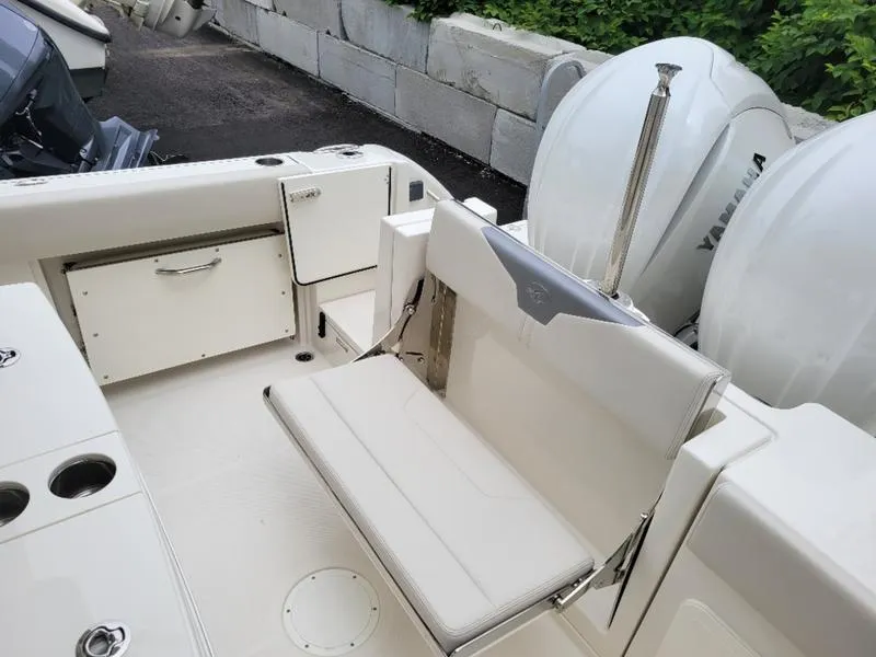 Slide: The Image of 2025 Sailfish 272 CC boat interior with seating and Yamaha engines. - 32