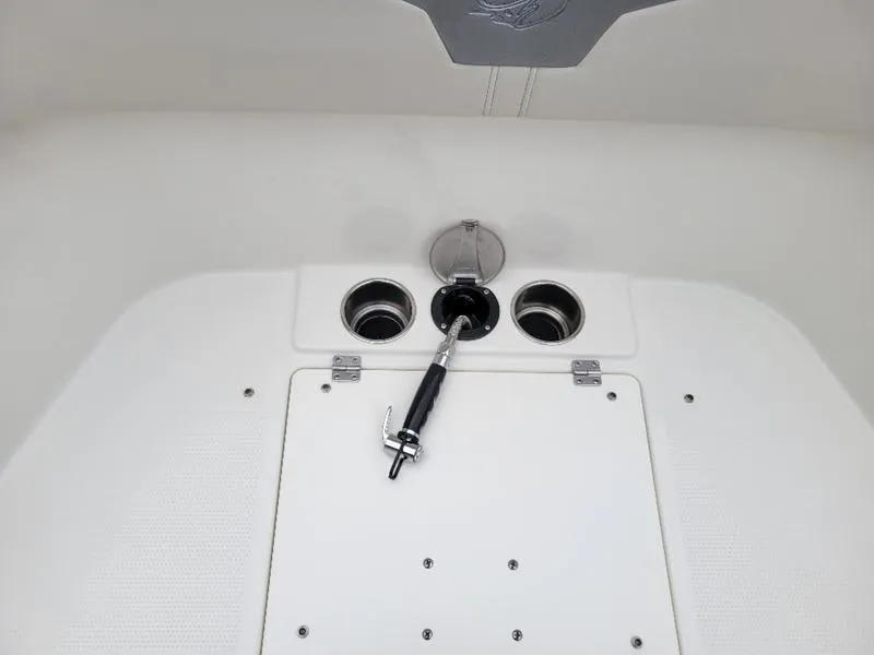 Slide: The Image of Sailfish 272 CC 2025 boat deck with rod holders and storage compartment. - 33