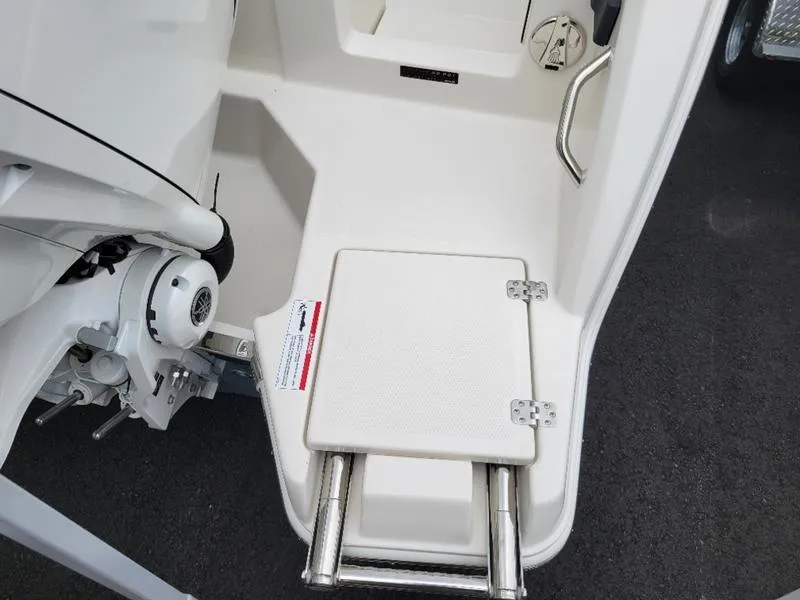 Slide: The Image of 2025 Sailfish 272 CC boat with foldable swim ladder and engine mount. - 8