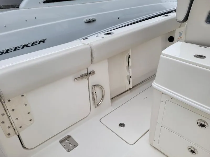 Slide: The Image of 2025 Sailfish 272 CC boat interior with storage compartments and seating. - 9