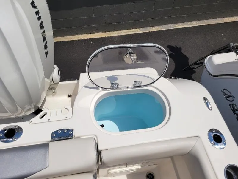 Slide: The Image of 2025 Sailfish 241 CC boat with open livewell and Yamaha engine. - 14