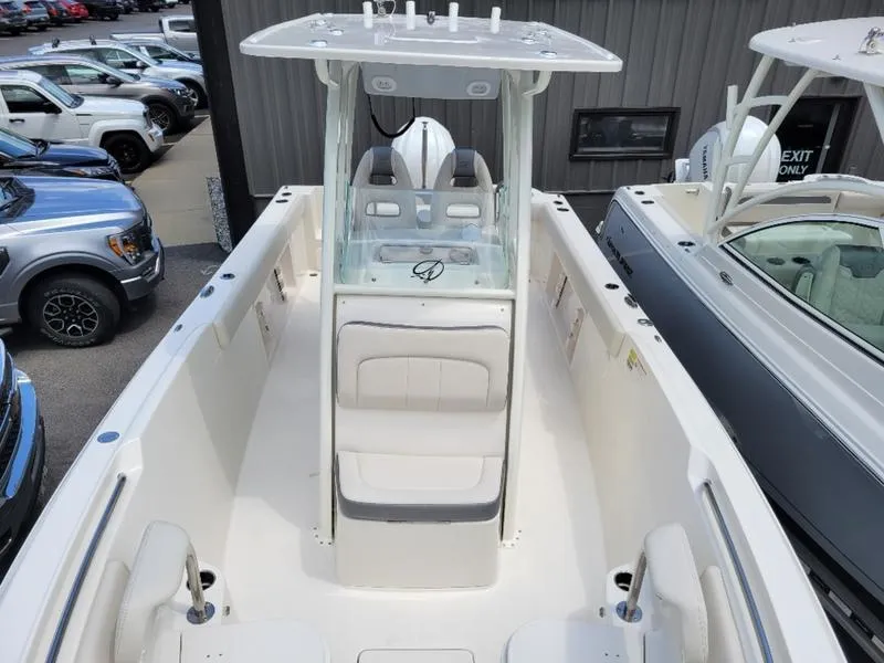 Slide: The Image of 2025 Sailfish 241 CC center console boat with seating and storage compartments. - 18