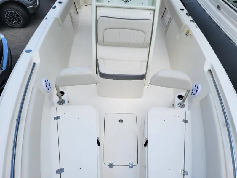 Slide: The Image of 2025 Sailfish 241 CC boat interior with seating and storage compartments. - 19