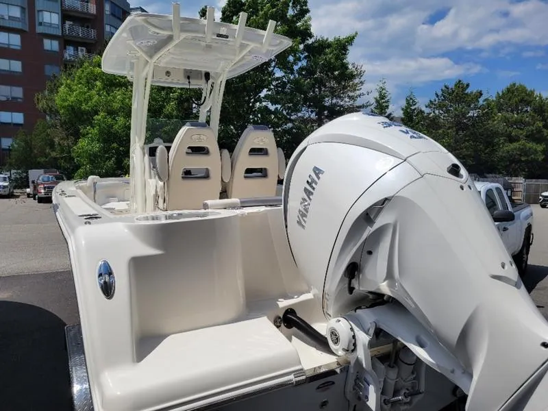 Slide: The Image of 2025 Sailfish 241 CC boat with Yamaha outboard motor in parking lot. - 4