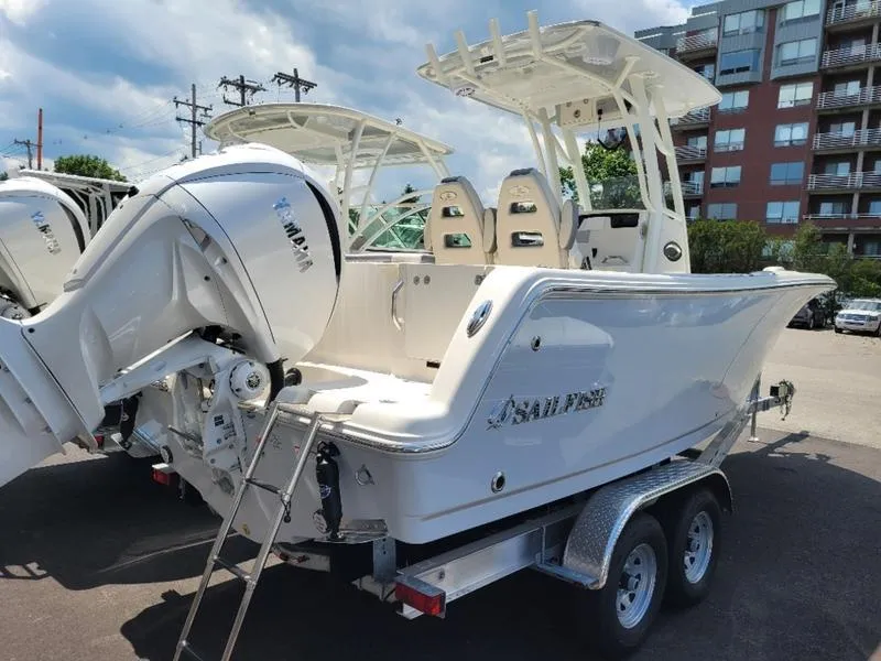 Slide: The Image of 2025 Sailfish 241 CC boat on trailer, rear view with outboard motor. - 5