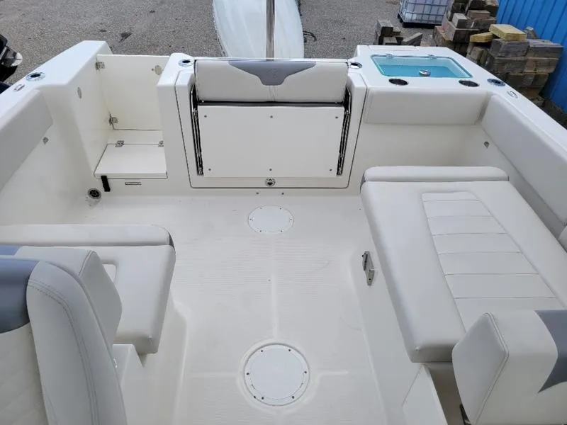 Slide: The Image of Interior of 2025 Sailfish 236 DC boat, featuring steering wheel and dashboard controls. - 14