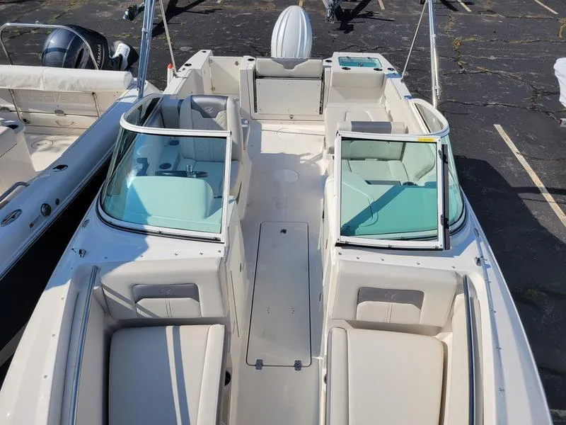 Slide: The Image of 2025 Sailfish 236 DC boat with spacious seating and modern design. - 11