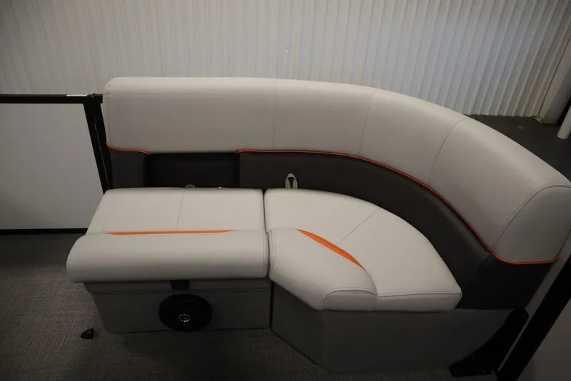 Slide: The Image of 2024 Bentley Pontoons 203 Bolt Tri-Toon interior seating with modern design and orange accents. - 12