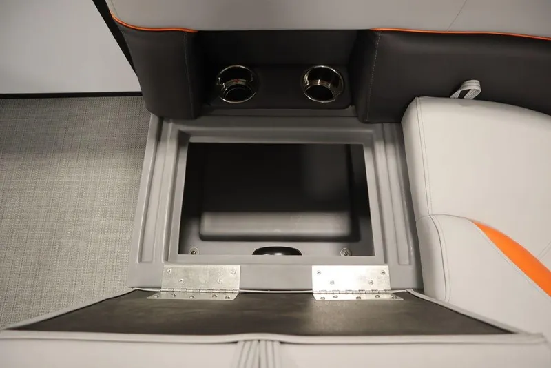 Slide: The Image of 2024 Bentley Pontoons 203 Bolt Tri-Toon storage compartment with cup holders and sleek interior design. - 13