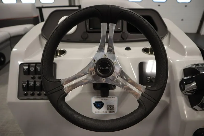Slide: The Image of 2024 Bentley Pontoons 203 Bolt Tri-Toon steering wheel and dashboard controls. - 19