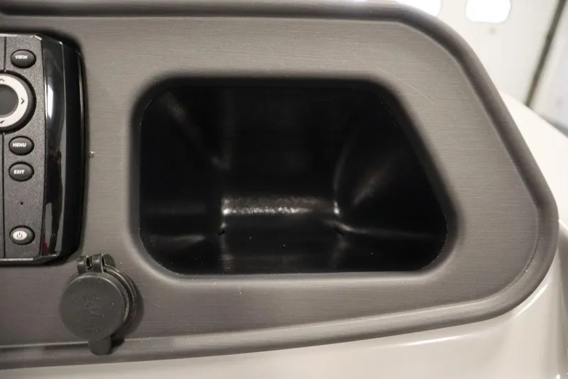 Slide: The Image of 2024 Bentley Pontoons 203 Bolt Tri-Toon dashboard compartment and control panel. - 21