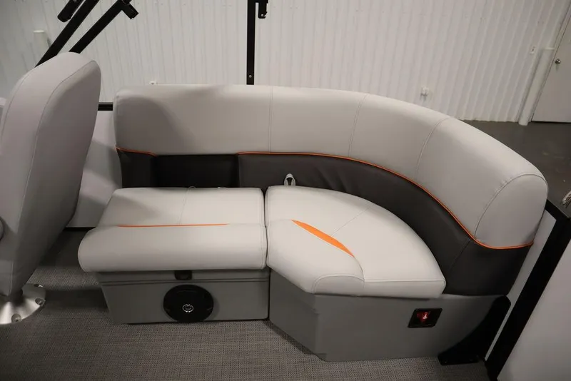 Slide: The Image of 2024 Bentley Pontoons 203 Bolt Tri-Toon interior seating with modern design and orange accents. - 36