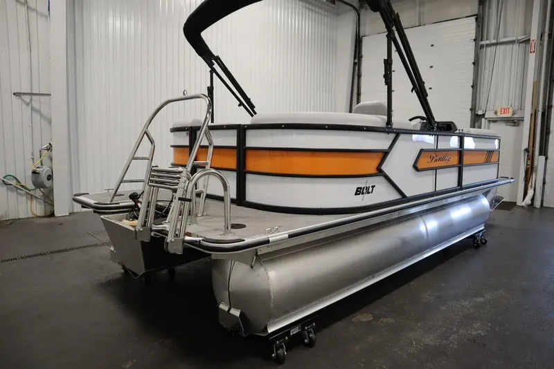 Slide: The Image of 2024 Bentley Pontoons 203 Bolt Tri-Toon in a showroom, showcasing sleek design and modern features. - 4