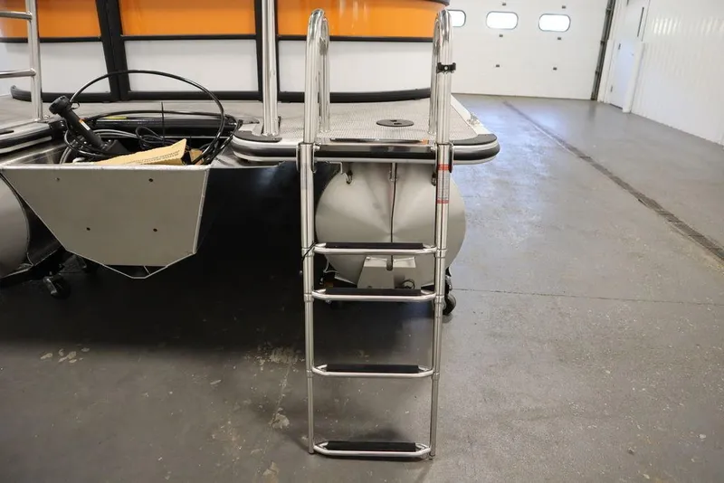 Slide: The Image of 2024 Bentley Pontoons 203 Bolt Tri-Toon with ladder in a garage setting. - 40