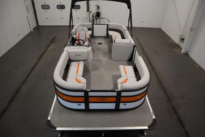 Slide: The Image of 2024 Bentley Pontoons 203 Bolt Tri-Toon in a spacious indoor setting. - 7