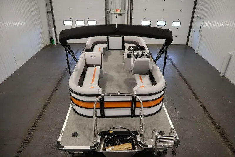 Slide: The Image of 2024 Bentley Pontoons 203 Bolt Tri-Toon in a spacious indoor setting. - 9