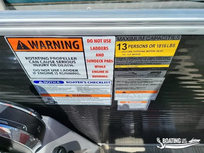 Slide: The Image of 2021 Bennington L25 Stern Radius warning and capacity labels, maximum 13 persons or 1816 lbs. - 16