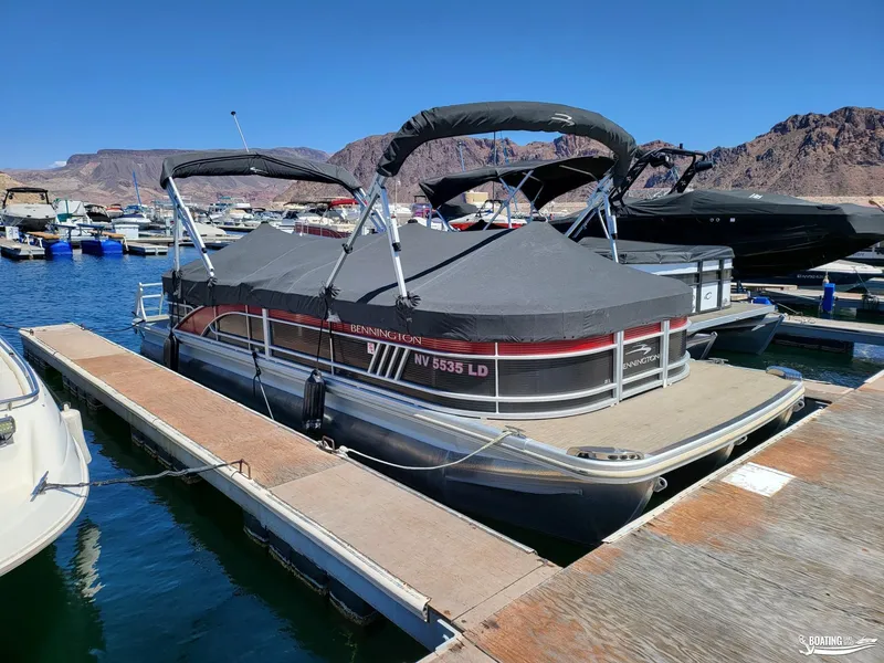 Slide: The Image of 2021 Bennington L25 Stern Radius pontoon boat docked at marina. - 5