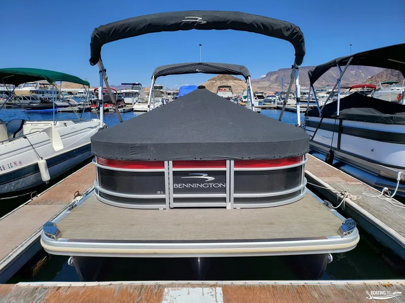Slide: The Image of 2021 Bennington L25 Stern Radius pontoon boat docked at marina. - 6