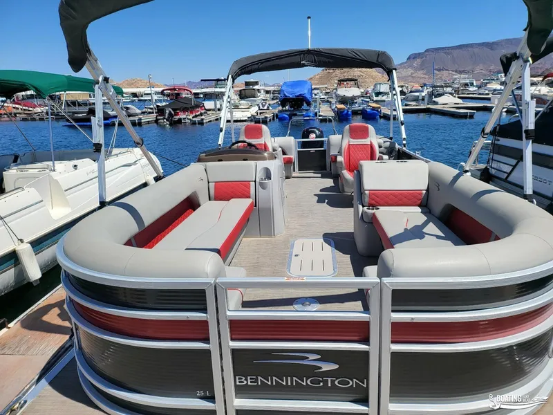 Slide: The Image of 2021 Bennington L25 Stern Radius pontoon boat docked at marina. - 8