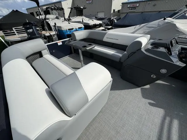 Slide: The Image of 2024 Bennington 22 SSR pontoon boat interior with plush seating and modern design. - 11