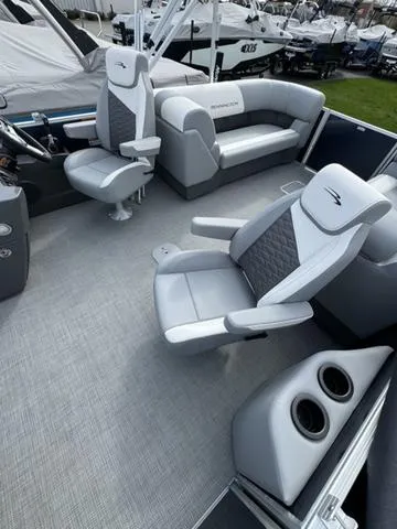 Slide: The Image of 2024 Bennington 22 SSR pontoon boat interior with luxurious seating and cup holders. - 13