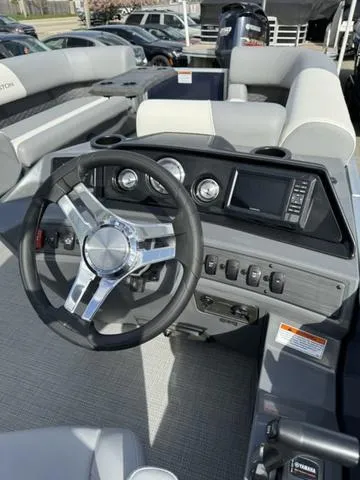 Slide: The Image of 2024 Bennington 22 SSR boat interior with steering wheel and dashboard controls. - 4