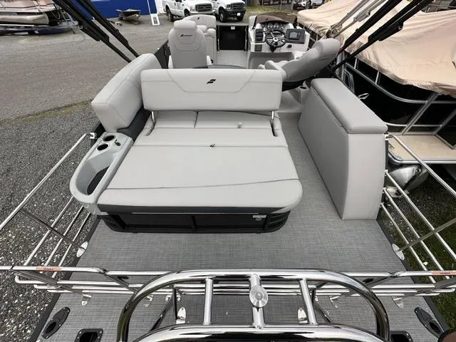 Slide: The Image of 2024 Starcraft SLS 3 Q DH pontoon boat interior with plush seating and modern design. - 4