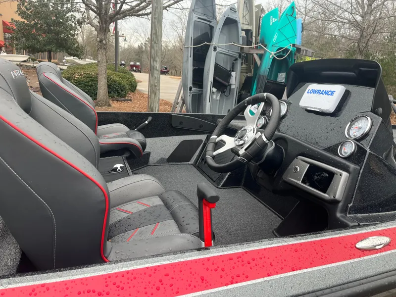 Slide: The Image of 2024 Nitro Z20 boat interior with steering wheel and Lowrance display. - 3