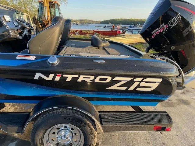 Slide: The Image of 2024 Nitro Z19 boat on trailer near lake. - 3