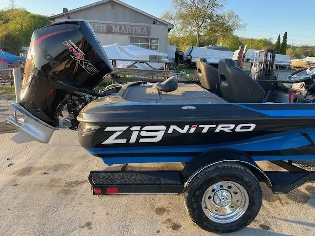 Slide: The Image of 2024 Nitro Z19 boat with Mercury Pro XS engine at a marina. - 4