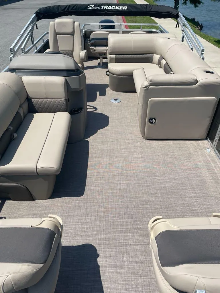 Slide: The Image of 2024 Sun Tracker Fishin' Barge 22 DLX pontoon boat with spacious seating. - 3