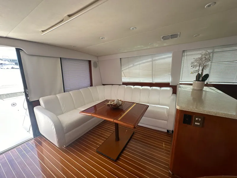 Slide: The Image of Luxurious interior of a 1999 Ocean 45 Super Sport yacht with white leather seating. - 14