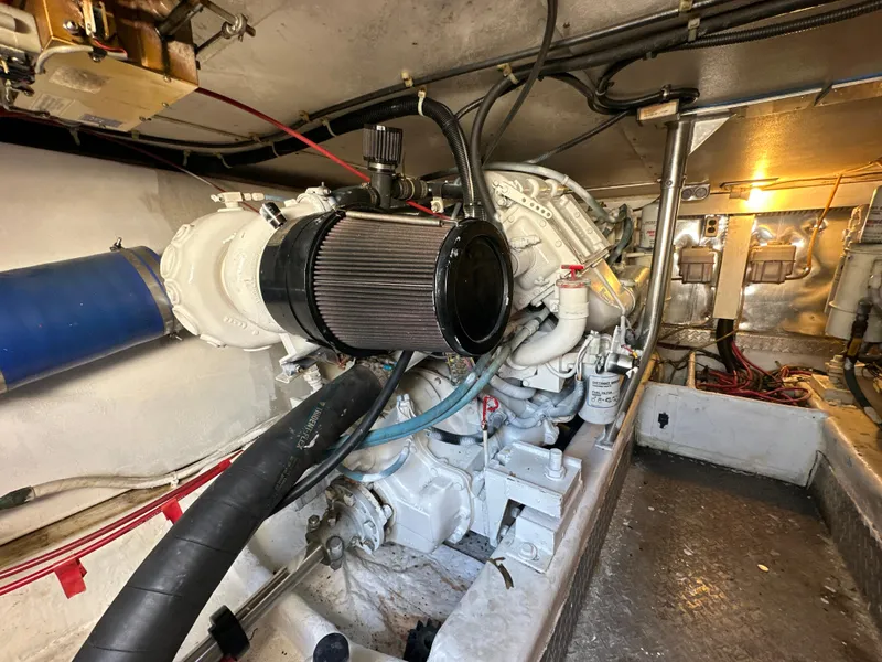 Slide: The Image of Engine room of a 1999 Ocean 45 Super Sport boat with visible machinery. - 23