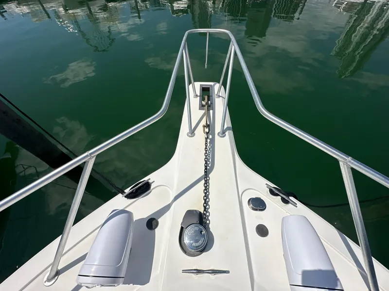 Slide: The Image of Bow of 1999 Ocean 45 Super Sport yacht with anchor chain and railings. - 29