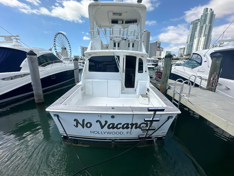 Slide: The Image of 1999 Ocean 45 Super Sport boat docked in marina, named No Vacancy, Hollywood, FL. - 3