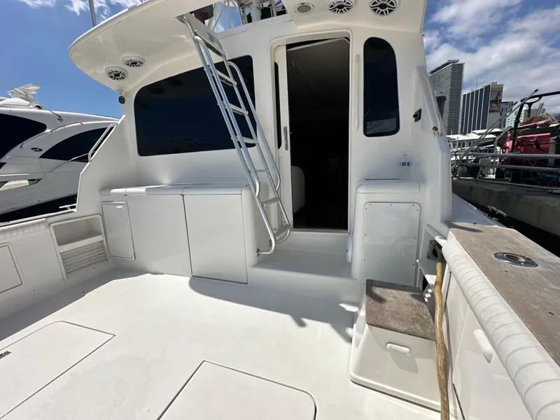 Slide: The Image of 1999 Ocean 45 Super Sport yacht deck with ladder and storage compartments. - 5