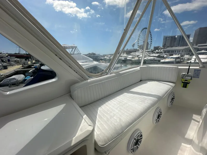 Slide: The Image of Interior view of 1999 Ocean 45 Super Sport yacht with marina backdrop. - 7