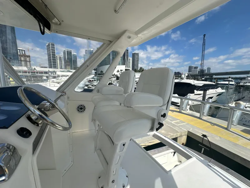 Slide: The Image of 1999 Ocean 45 Super Sport yacht interior with marina view and city skyline. - 9