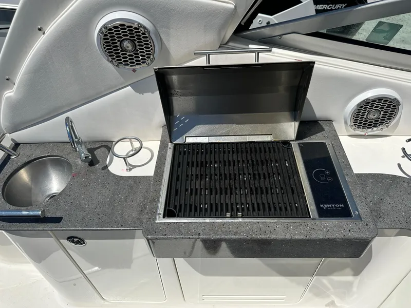 Slide: The Image of Outdoor kitchen on 2012 Sea Ray 330 Sundancer with grill and sink. - 14