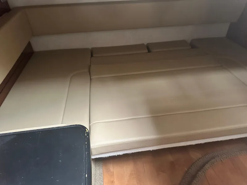 Slide: The Image of Interior cabin seating of 2012 Sea Ray 330 Sundancer boat, beige upholstery. - 34