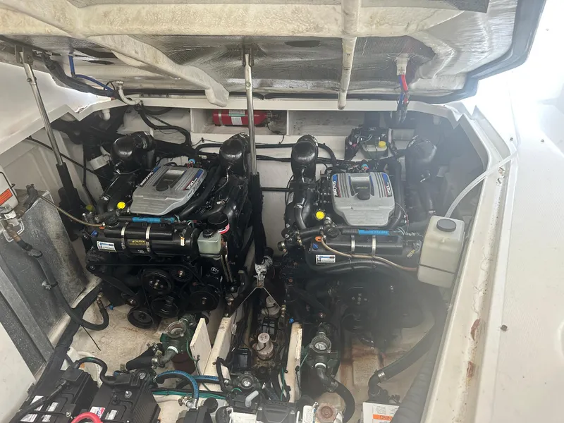 Slide: The Image of Engine compartment of a 2012 Sea Ray 330 Sundancer with dual engines. - 40